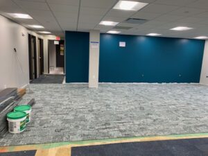 A room with blue walls and a green floor.