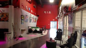 A red room with a large wall and a black table